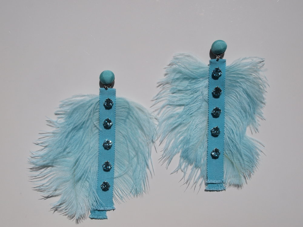 feather earrings in aqua
